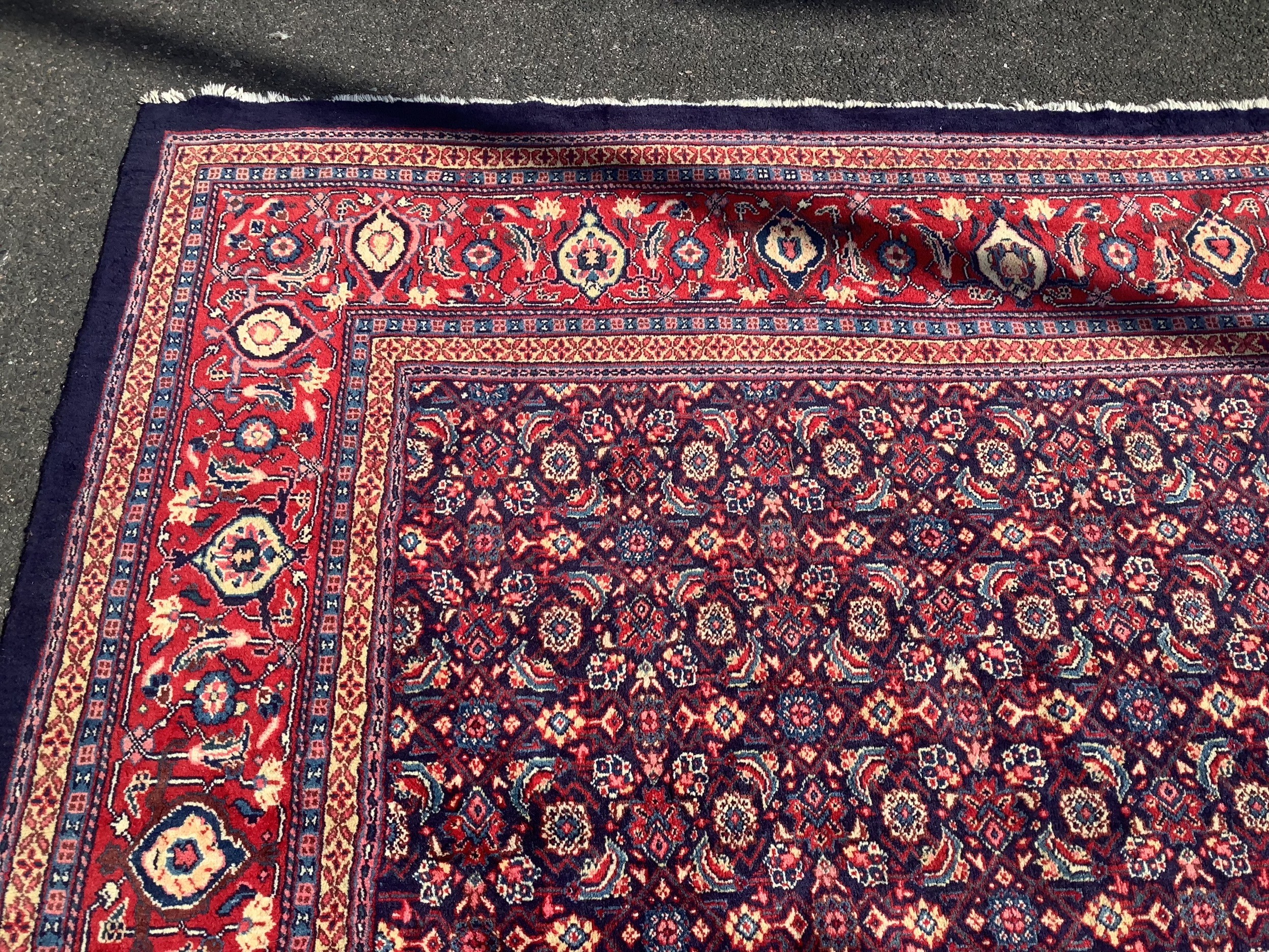 A North West Persian blue ground carpet, 534 x 325cm